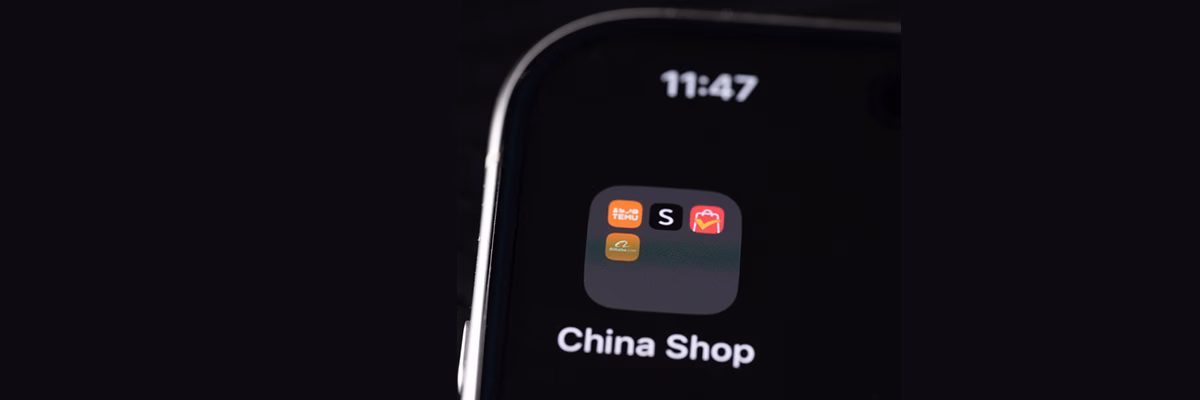 New York, USA - July 25, 2024: Buying from china online shop on iphone screen macro close up view